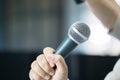 Seminar Speaking Conference Concept : Microphone of speech in seminar room or speaking conference hall light bokeh background. Royalty Free Stock Photo