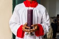 Seminarian carries a seven-day candle on the Day of the Dead holiday at the Campo Santo cemetery in the city of Salvador, Bahia Royalty Free Stock Photo
