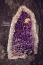 Semiprecious gemstone of amethyst with calcite