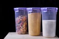 Semolina, corn grits and multicolored pasta in plastic jars