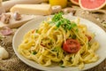 Semolina pasta with roasted garlic, sprinkled microherbs