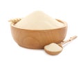 Semolina in wooden bowl and spoon on white background Royalty Free Stock Photo