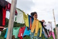 Unidentified woman picking up the clothes on the clothesline