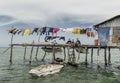 Bajau tribe family sitting outside their wooden house in Sabah Semporna, Malaysia