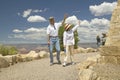 Senator and Mrs. John Kerry walking down path and waving at rim of Bright Angel Lookout, Grand Canyon, AZ