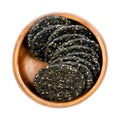 Senbei, Japanese macrobiotic sesame crackers, in a wooden bowl