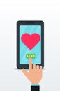 Sending love message using flat smartphone with pink heart icon on touch screen. Finger push send button. Royalty Free Stock Photo