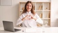 Sending love office woman inspired work smiling Royalty Free Stock Photo