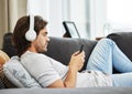 Sending a risky text has never been this nerve wracking. Shot of a young man relaxing on his sofa in the lounge while