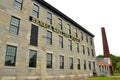 Seneca Knitting Mills historic limestone building and chimney Royalty Free Stock Photo