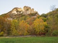 Seneca Rocks summit in sunset with bridge and trees in fall colors in the foreground Royalty Free Stock Photo
