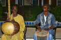 Black men playing traditional african music during night