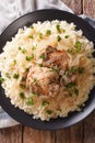 Senegalese cuisine: chicken Yassa with couscous and onions close