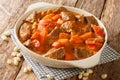 Senegalese stew of beef in peanut sauce with vegetables close-up in a dish. horizontal