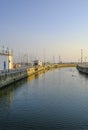 Senigallia, Italy: view of the canal on the sunrise over yachts in boats in port and flying seagulls. Urban view. Royalty Free Stock Photo