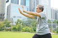 Senile doing Tai Chi in the park