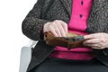 Senile female hands with wallet