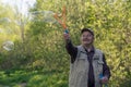 Senior active man plays with soap bubbles outdoor Royalty Free Stock Photo