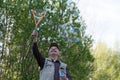 Senior active man plays with soap bubbles outdoor Royalty Free Stock Photo