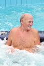 Senior active man swims in the pool Royalty Free Stock Photo