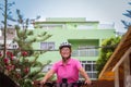 Senior active woman cycling in the city on her electric bicycle - elderly attractive female enjoying healthy lifestyle