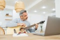 Senior Adult Man playing acoustic guitar Royalty Free Stock Photo