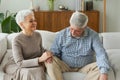 Senior adult mature couple in love holding hands at home. Mid age old husband and wife looking with tenderness love Royalty Free Stock Photo