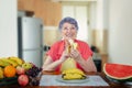 Senior adult woman eating bananas with pleasure