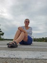 Senior Woman Relaxing On Street at the Sanibel Florida Wildlife Refuge