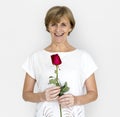 Senior Adult Woman Smiling Happiness Flower Studio Portrait Royalty Free Stock Photo