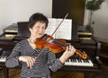 Senior Adult Women Playing the Violin