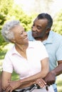 Senior African American Couple Cycling In Park Royalty Free Stock Photo