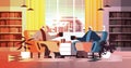 senior african american couple drinking coffee and talking together at home living room interior horizontal Royalty Free Stock Photo