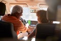 Senior African American Couple On Drive Through Countryside Using Sat Nav On Mobile Phone Royalty Free Stock Photo