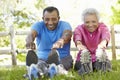 Senior African American Couple Exercising In Park Royalty Free Stock Photo