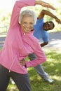 Senior African American Couple Exercising In Park Royalty Free Stock Photo