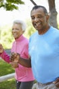 Senior African American Couple Jogging In Park Royalty Free Stock Photo
