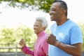 Senior African American Couple Jogging In Park Royalty Free Stock Photo