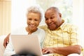 Senior African American couple using laptop