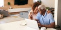 Senior African American Couple Using Laptop To Check Finances At Home Royalty Free Stock Photo