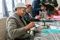 Senior African American female doing arts and crafts at an event