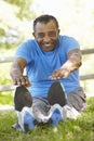 Senior African American Man Exercising In Park Royalty Free Stock Photo