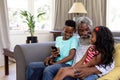 Senior African American man and his grandchildren enjoying their time at home Royalty Free Stock Photo