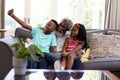Senior African American man and his grandchildren at home Royalty Free Stock Photo