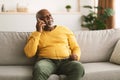 Senior African American Man Talking On Cellphone Sitting At Home Royalty Free Stock Photo