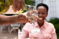 Senior African American woman and her family spending time together in the garden Royalty Free Stock Photo