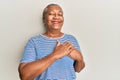 Senior african american woman wearing casual clothes smiling with hands on chest, eyes closed with grateful gesture on face Royalty Free Stock Photo