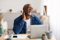 Senior African Man Touching Aching Neck Having Neckache In Office Royalty Free Stock Photo