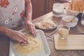 Senior alone at home cooking fish at the kitchen -  very focused indoor - mature and caucasian 60s woman - retired woman Royalty Free Stock Photo