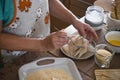 Senior alone at home cooking fish at the kitchen -  very focused indoor - mature and caucasian 60s woman - retired woman Royalty Free Stock Photo